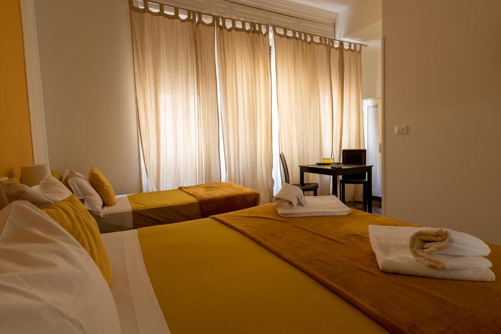 Postel nebo postele na pokoji v ubytování Granello Suite Central