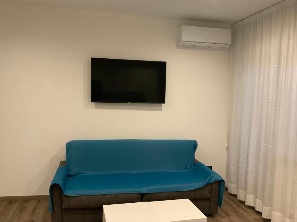 TV a/nebo společenská místnost v ubytování Albergo Cappello e Cadore