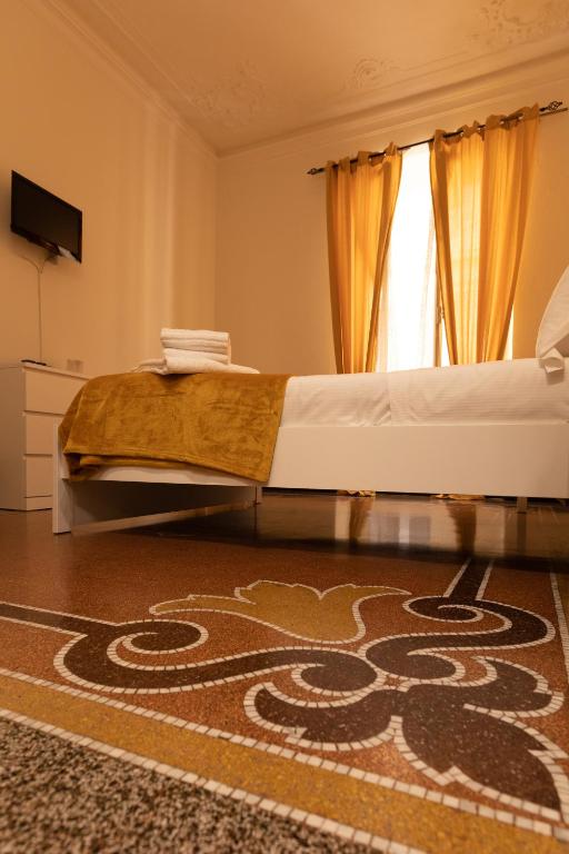 Postel nebo postele na pokoji v ubytování Granello Suite Central