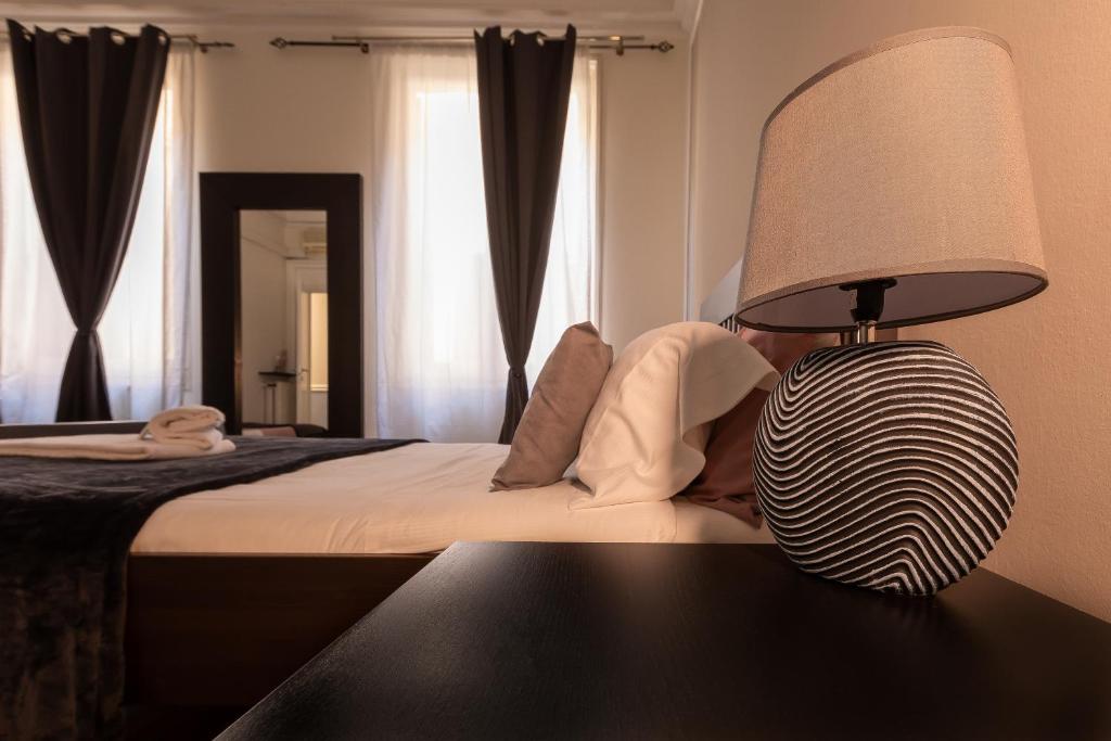Postel nebo postele na pokoji v ubytování Granello Suite Central