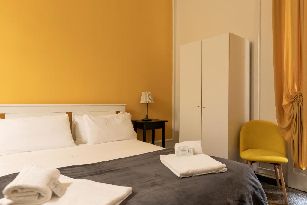 Postel nebo postele na pokoji v ubytování Granello Suite Central