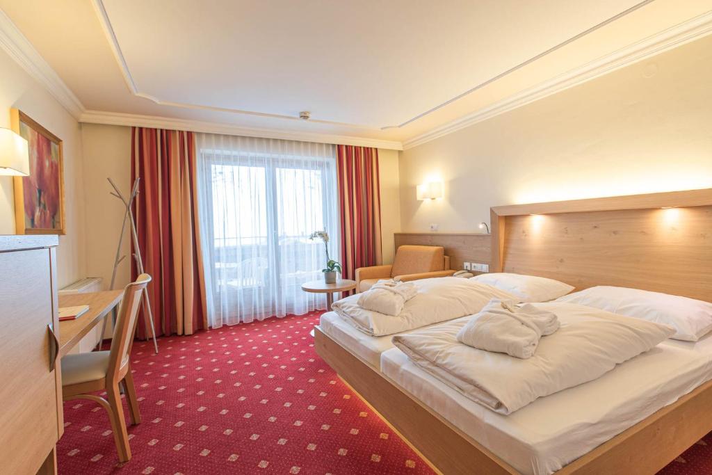 Posteľ alebo postele v izbe v ubytovaní Hotel Sportalmmm, Hoch-Genuss