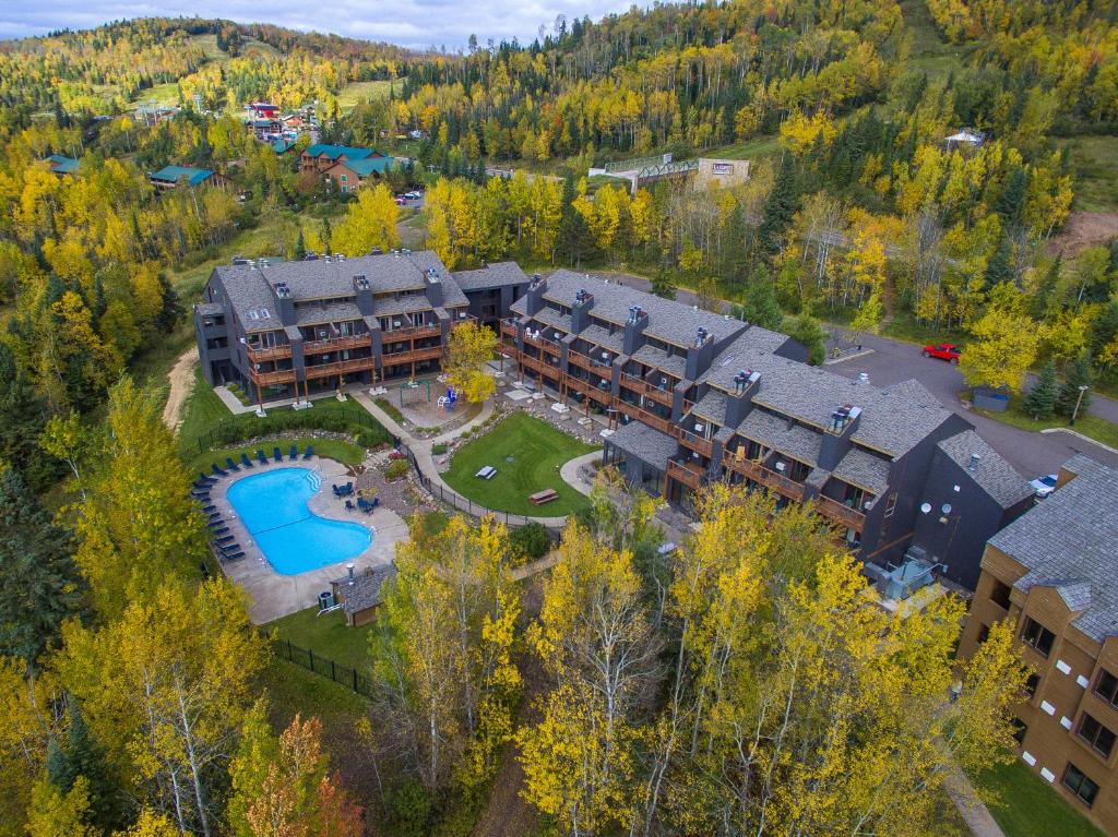 an aerial view of a resort building with a pool at Caribou Highlands Lodge in Lutsen