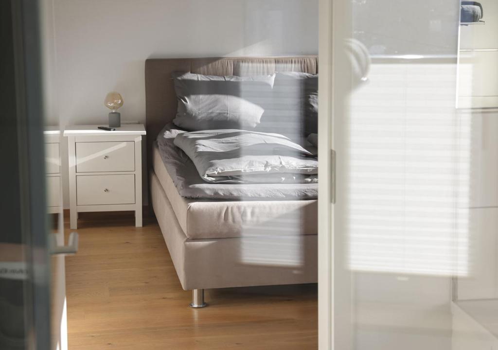 Postel nebo postele na pokoji v ubytování Residenz Kirchberg