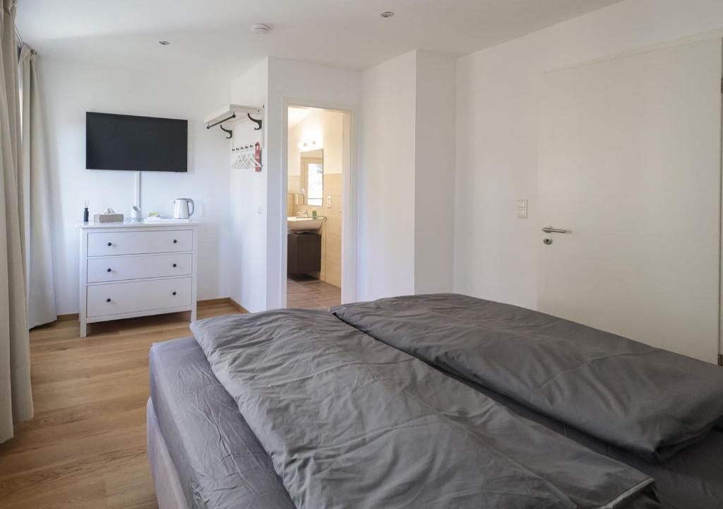 Postel nebo postele na pokoji v ubytování Residenz Kirchberg