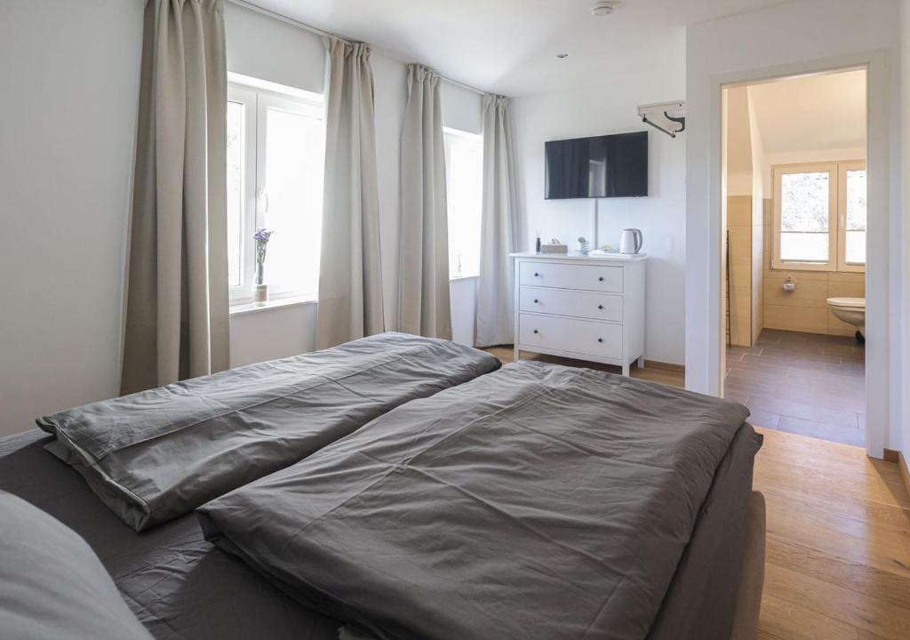 Postel nebo postele na pokoji v ubytování Residenz Kirchberg