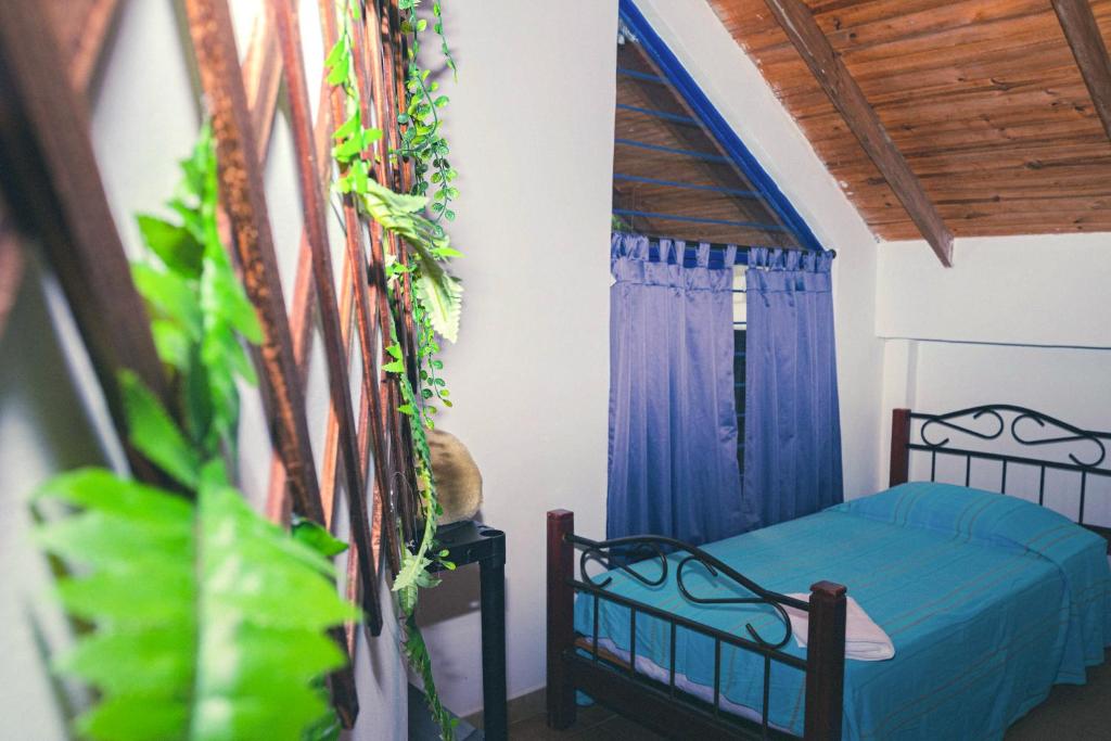 Cama o camas de una habitación en Ecovilla Cali
