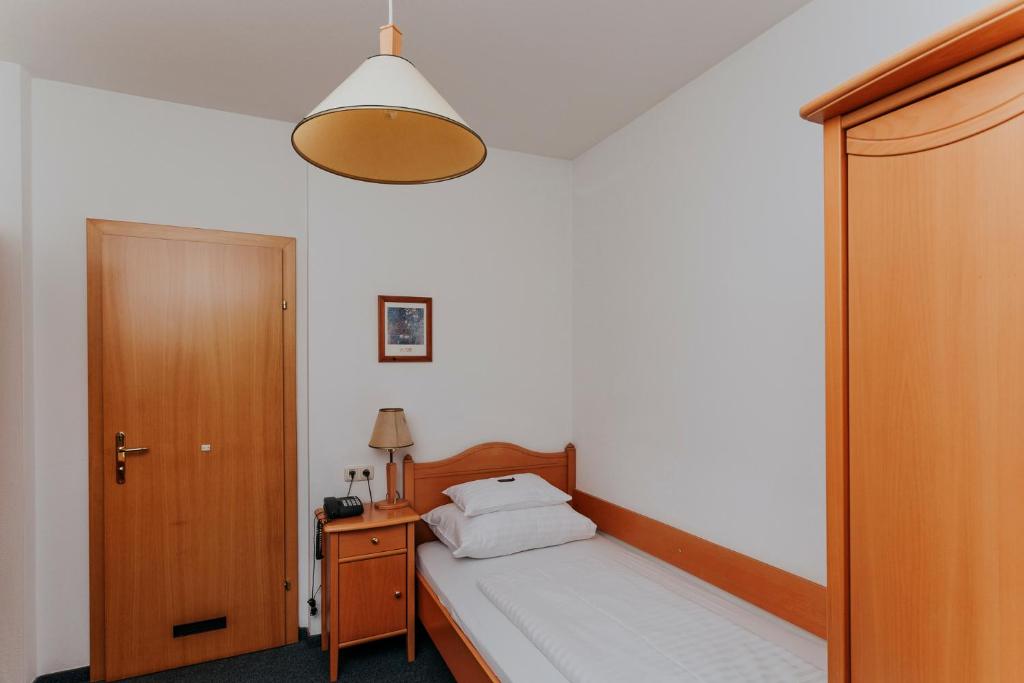 Posteľ alebo postele v izbe v ubytovaní Hotel Friesacherhof