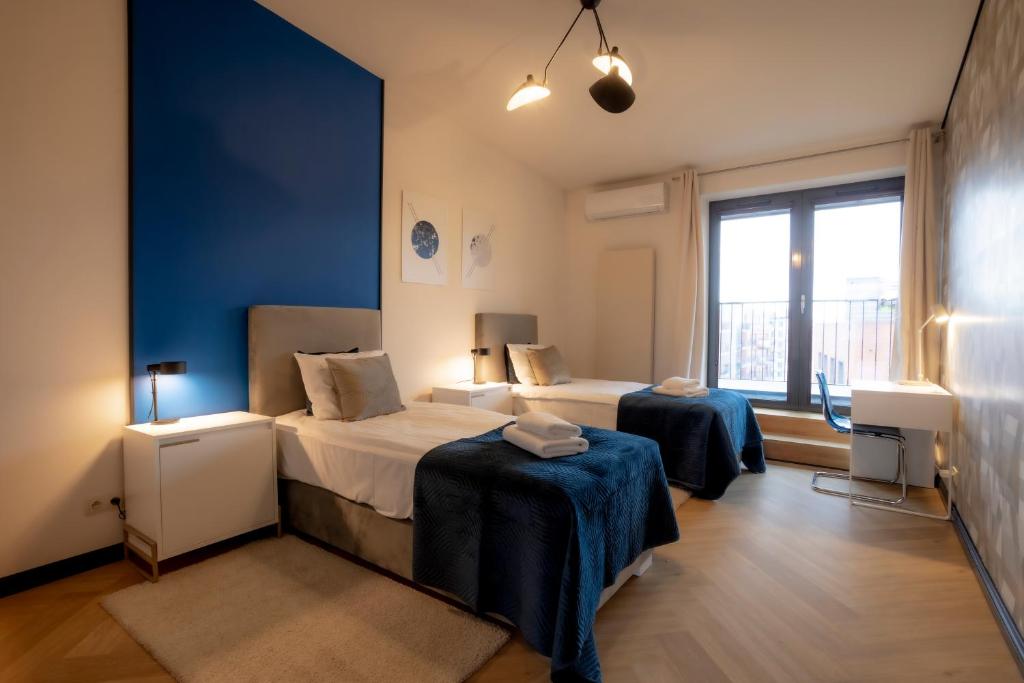Posteľ alebo postele v izbe v ubytovaní Penthouse Cracow
