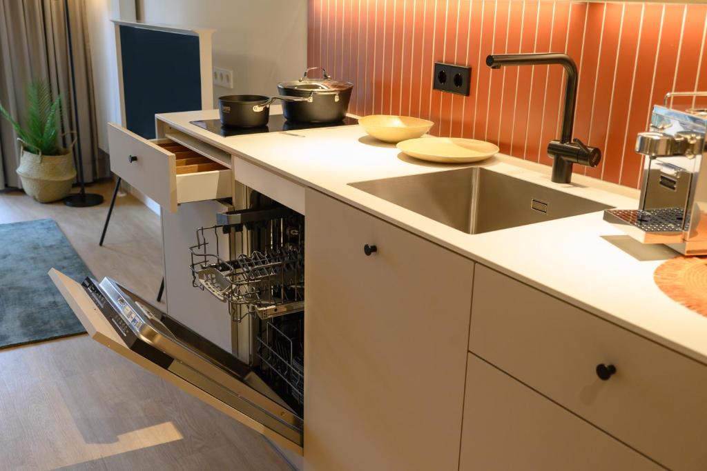 Kuchyň nebo kuchyňský kout v ubytování InselMühle