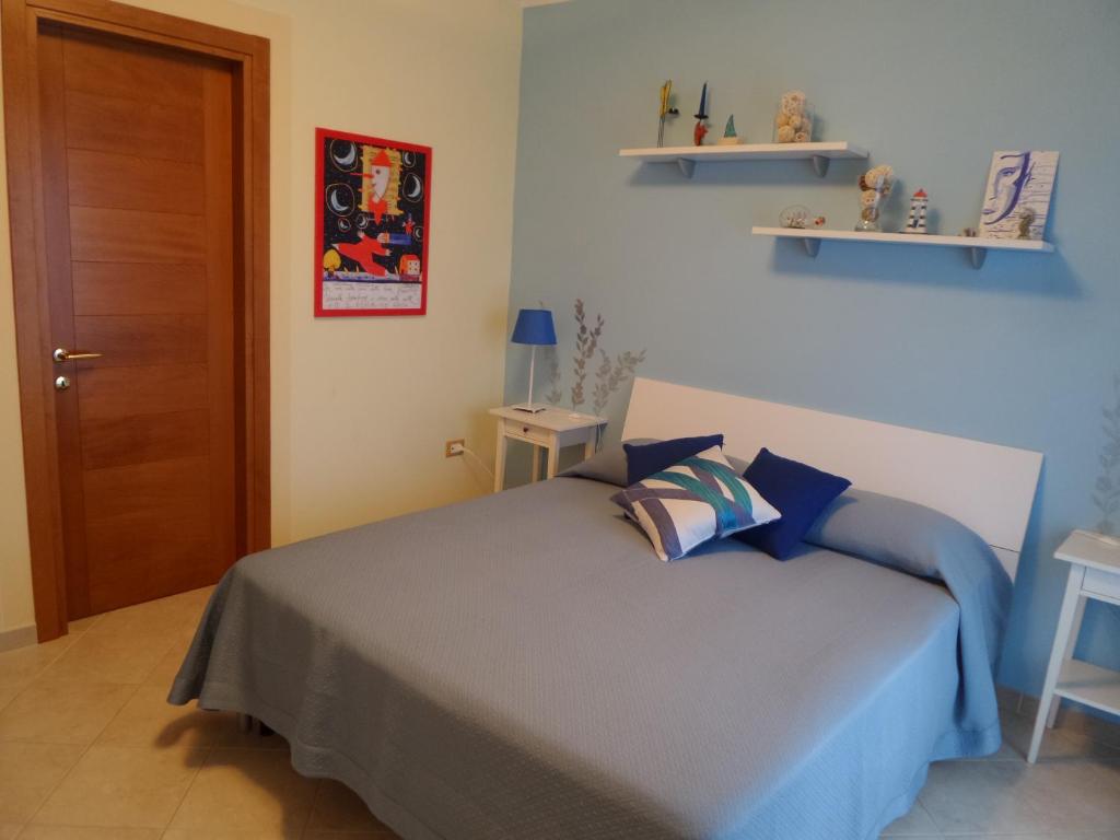 A bed or beds in a room at Il Giardino delle Zagare