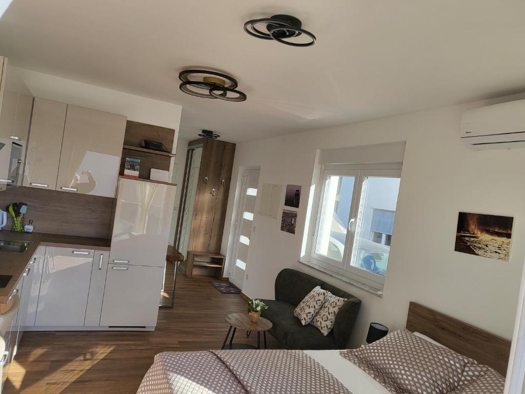 Kuchyň nebo kuchyňský kout v ubytování Studio apartman Pegi