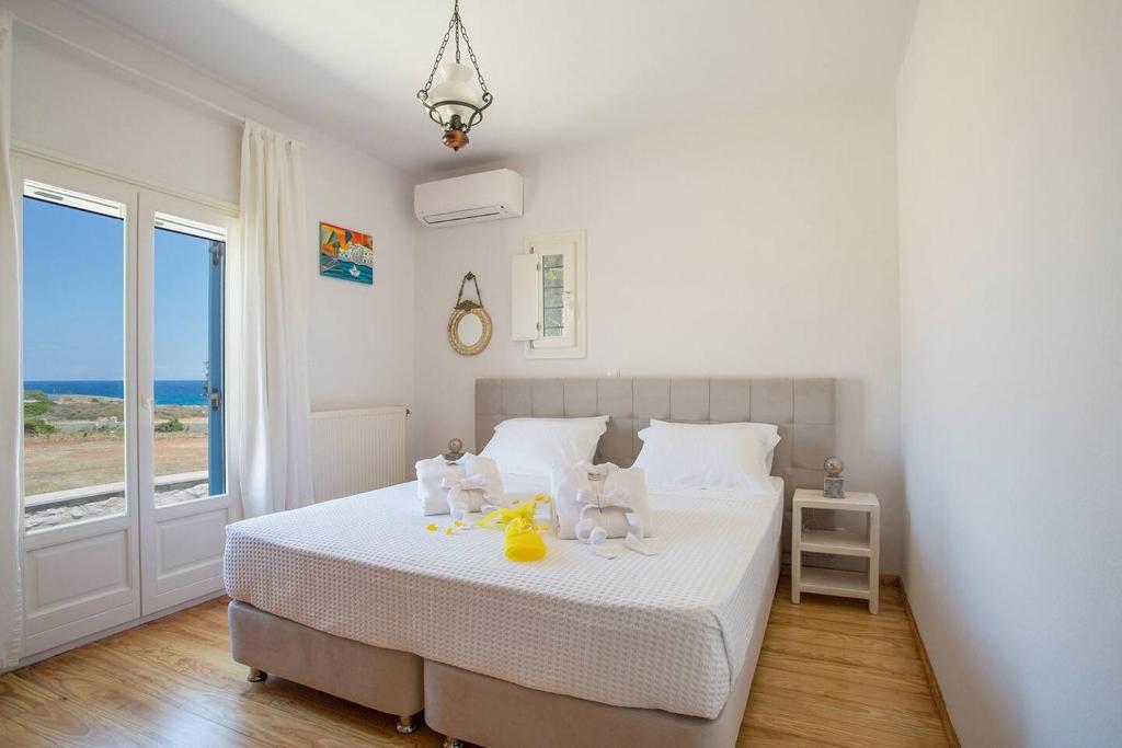 A bed or beds in a room at SAIL VILLA