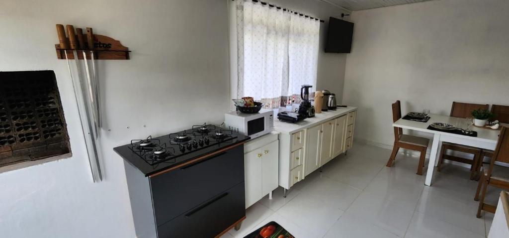 Kuchyň nebo kuchyňský kout v ubytování Apartamento PRATICO