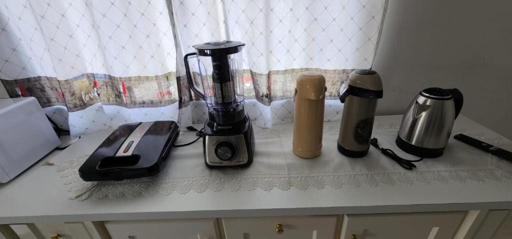 Příslušenství pro přípravu čaje a kávy v ubytování Apartamento PRATICO