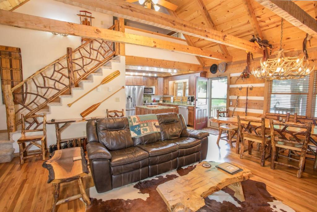 a living room with a couch and a table at Fox Haven in Seven Devils