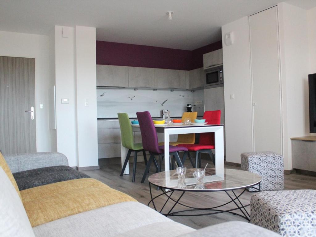a living room with a table and chairs at Appartement La Rochelle, 3 pièces, 4 personnes - FR-1-246-588 in La Rochelle
