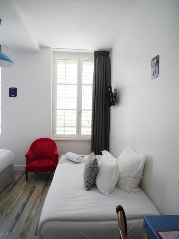 Postel nebo postele na pokoji v ubytování Hôtel du Simplon