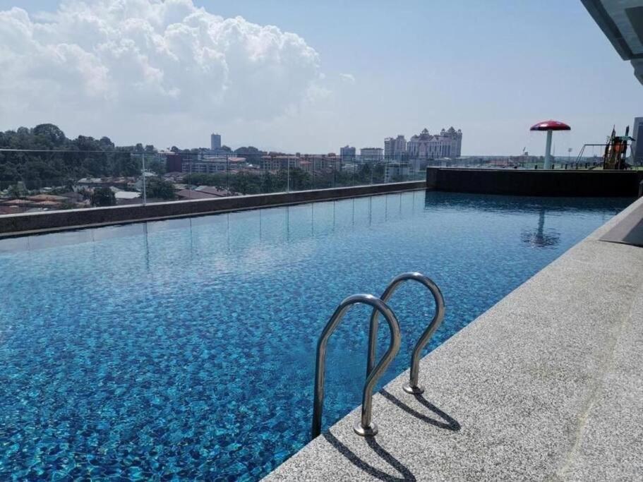 a swimming pool with a view of a city at Free Netflix&WiFi Putrizarreth Skyhouse Kt Town in Kuala Terengganu