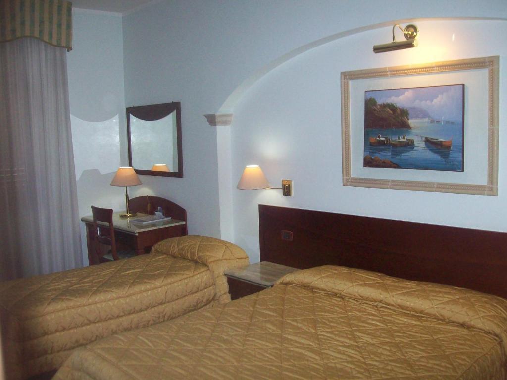 Postel nebo postele na pokoji v ubytování Palmed Hotel