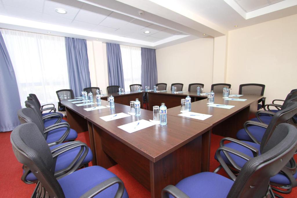a conference room with a long table and chairs at Hotel Rio in Nairobi