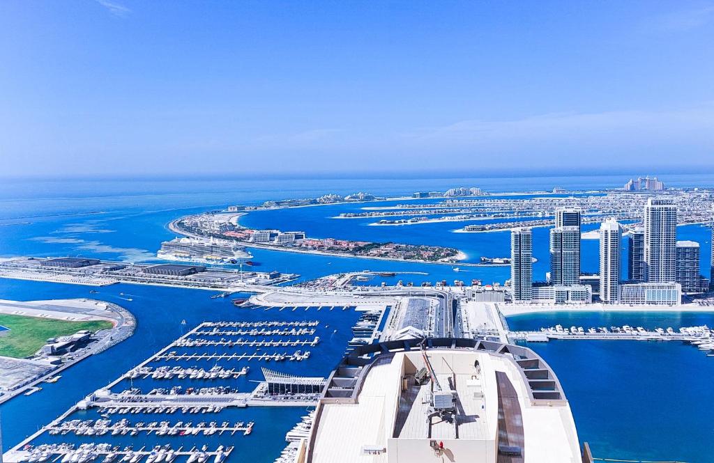 an aerial view of a marina with a city at Hawana Hostel in Dubai