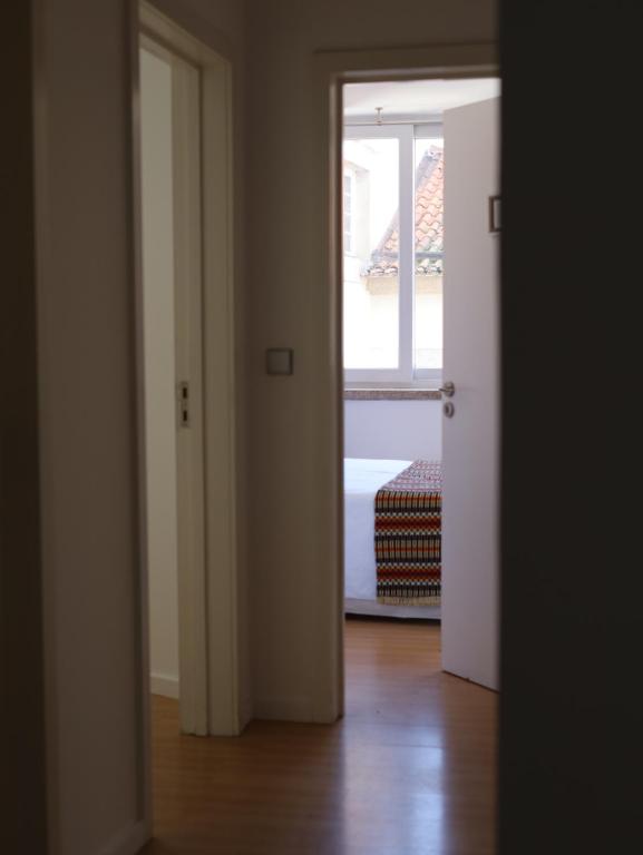 an open door to a room with a window at House Prada in Bragança