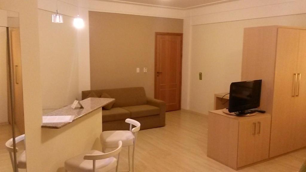 TV a/nebo společenská místnost v ubytování Itajubá Flat Hotel