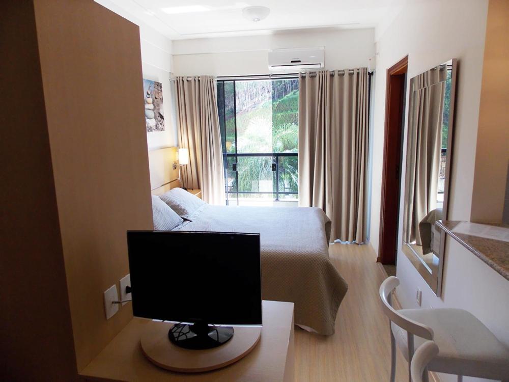 TV a/nebo společenská místnost v ubytování Itajubá Flat Hotel
