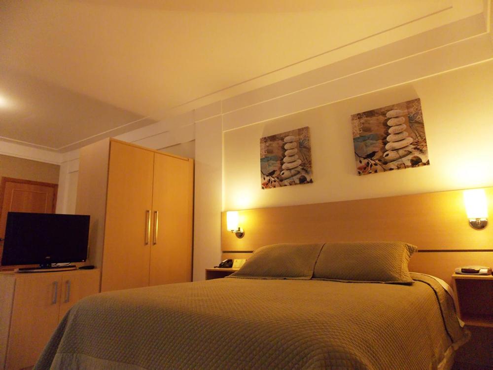 TV a/nebo společenská místnost v ubytování Itajubá Flat Hotel