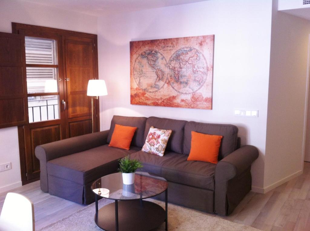 a living room with a couch and a table at Superb Central Market Apt in Valencia