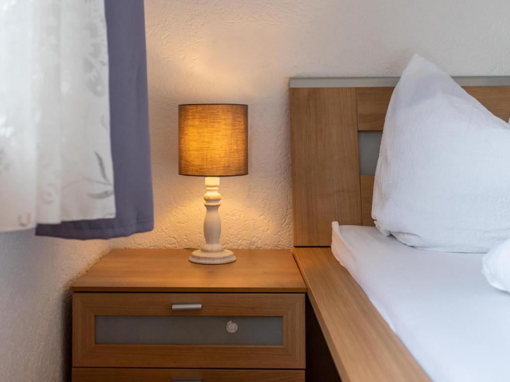 Postel nebo postele na pokoji v ubytování Haus Wald
