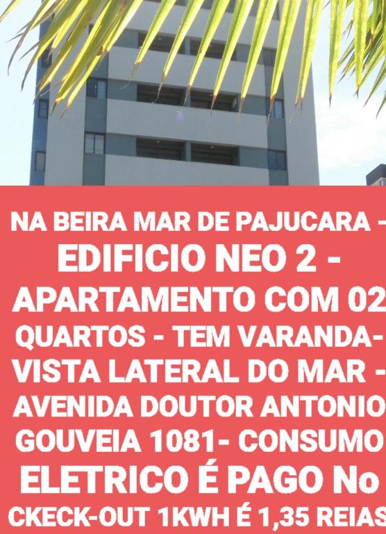 a sign in front of a tall building at NA BEIRA MAR DE PAJUCARA - EDIFICIO NEO 2 - APARTAMENTO COM 02 QUARTOS - TEM VARANDA- VISTA LATERAL DO MAR - AVENIDA DOUTOR ANTONIO GOUVEIA 1081- CONSUMO ELETRICO É PAGO No CKECK-OUT 1KWH É 1,35 REIAS in Maceió