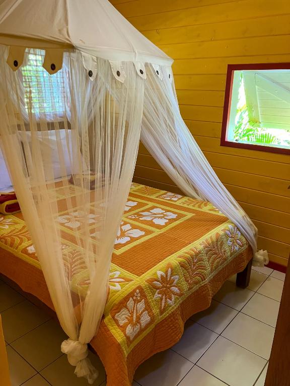 Postel nebo postele na pokoji v ubytování Gîte Zandoli Koko