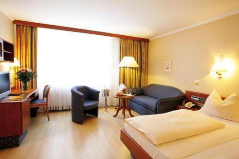Postel nebo postele na pokoji v ubytování Hotel Carmen