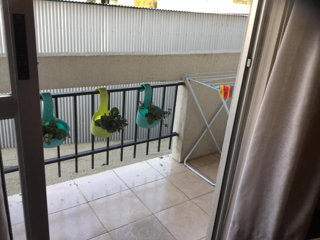 Balkón nebo terasa v ubytování Conforto e simplicidade no centro da cidade