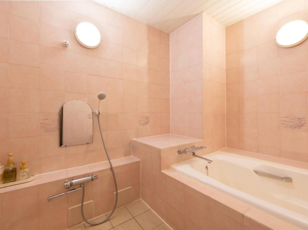 Koupelna v ubytování Tabist Hotel Rakuserina
