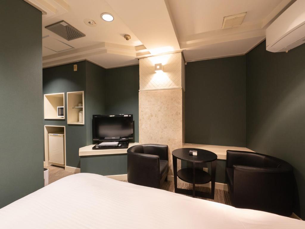 TV a/nebo společenská místnost v ubytování Tabist Hotel Rakuserina