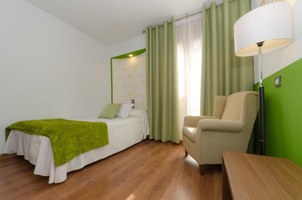 Postel nebo postele na pokoji v ubytování Hotel Apolo