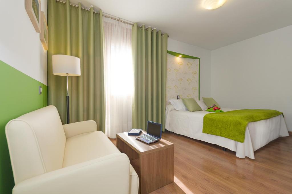 Postel nebo postele na pokoji v ubytování Hotel Apolo