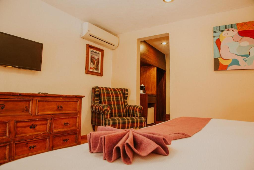 Postel nebo postele na pokoji v ubytování Hotel Holly
