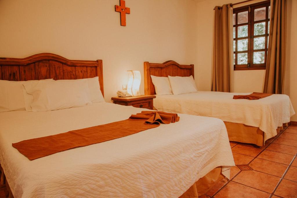 Postel nebo postele na pokoji v ubytování Hotel Holly