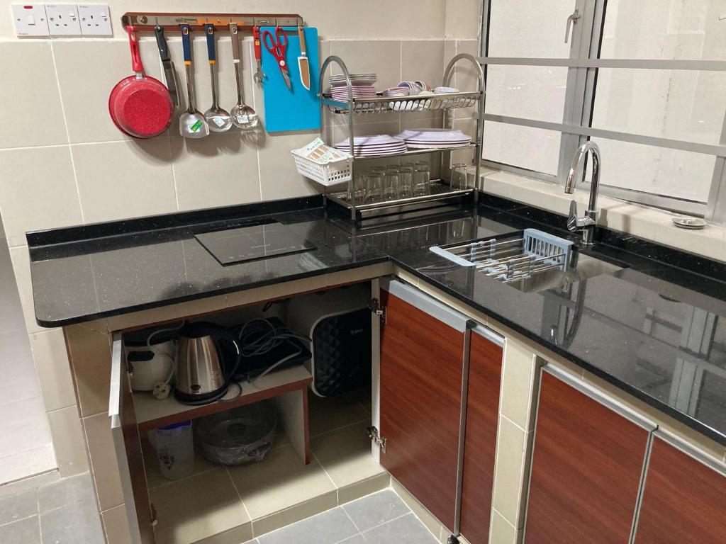 a kitchen with a sink and a counter top at Jo’s Place Cameron Highlands EA922 in Brinchang