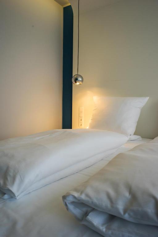 Postel nebo postele na pokoji v ubytování Hotel Knorz
