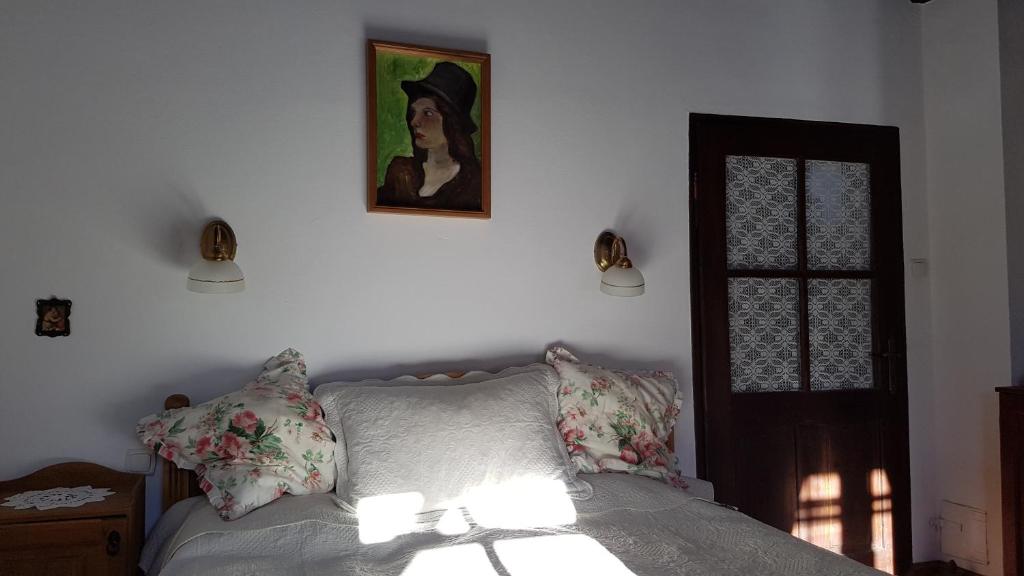 A bed or beds in a room at Cziróka Vendégház