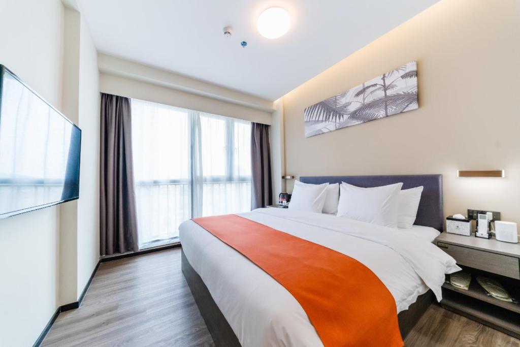 Shenzhen Kingkey Kingyu Hotel 객실 침대