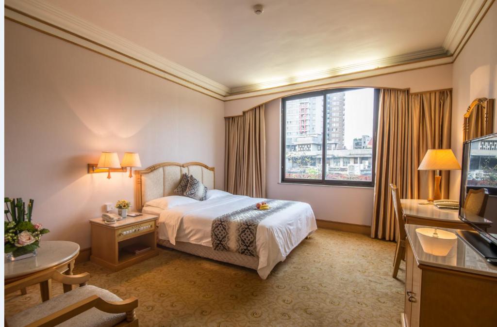 Postel nebo postele na pokoji v ubytování Panyu Hotel