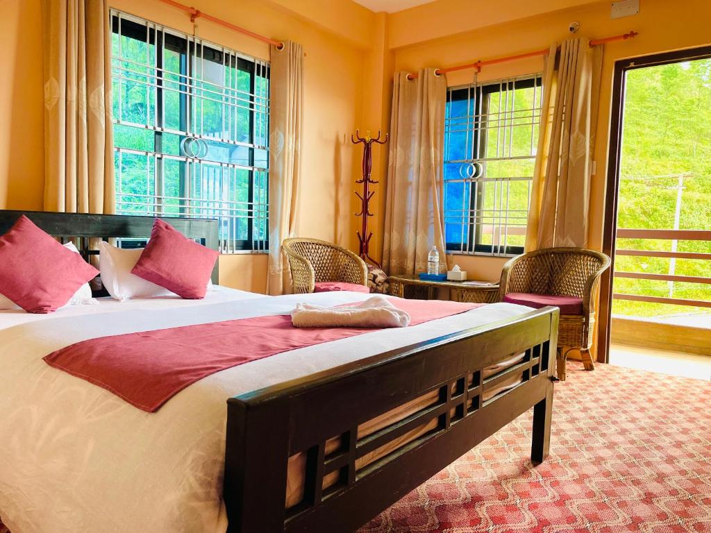 Postel nebo postele na pokoji v ubytování Hotel Brisha Sarangkot