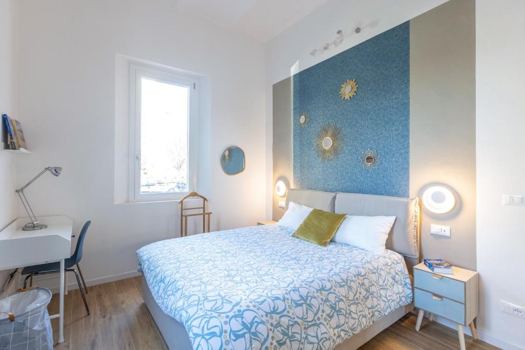A bed or beds in a room at CaseOspitali - Daimò, delizioso bilocale Fiera perfetto per 5