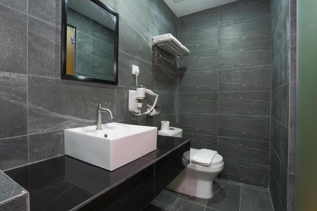 Koupelna v ubytování YEE HOTEL Permas Jaya